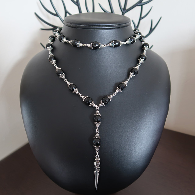 A black glass beaded necklace